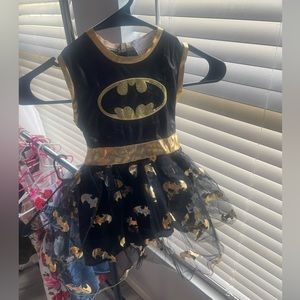 Batgirl costume, never worn before and it includes mask, arm pieces and cape.